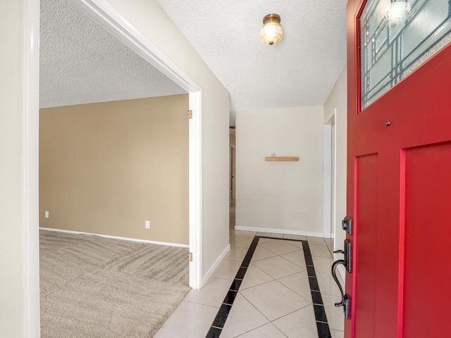 1646 W Millbrae Ave, Fresno, CA 93711 - entryway with baseboards and a textured ceiling