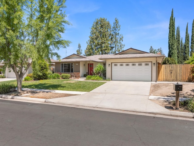 1646 W Millbrae Ave, Fresno, CA 93711 - single story home featuring a garage, concrete driveway, and stucco siding