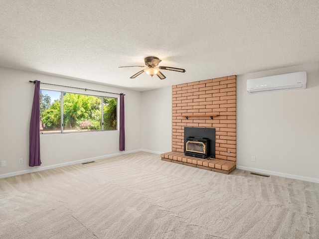 1646 W Millbrae Ave, Fresno, CA 93711 - unfurnished living room featuring a wall unit AC, a ceiling fan, a textured ceiling, carpet, and baseboards