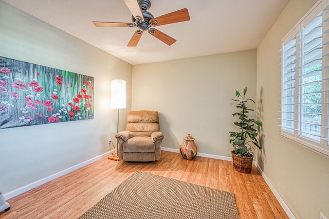2895 W Kensington Ln, Fresno, CA 93711 - living area with wood finished floors, a ceiling fan, and baseboards