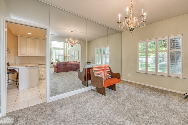 2895 W Kensington Ln, Fresno, CA 93711 - living area with a chandelier, light colored carpet, and baseboards