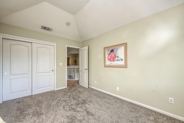 2895 W Kensington Ln, Fresno, CA 93711 - unfurnished bedroom with carpet, vaulted ceiling, baseboards, and a closet