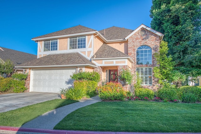 2895 W Kensington Ln, Fresno, CA 93711 - traditional-style house featuring driveway, stucco siding, a front yard, a garage, and roof with shingles