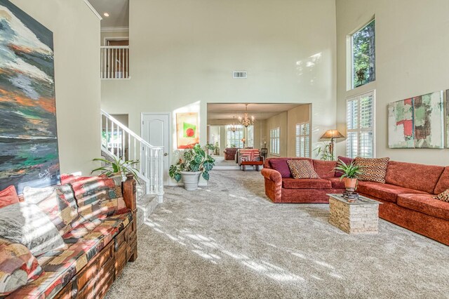 2895 W Kensington Ln, Fresno, CA 93711 - living area with a towering ceiling, carpet, stairs, and a chandelier