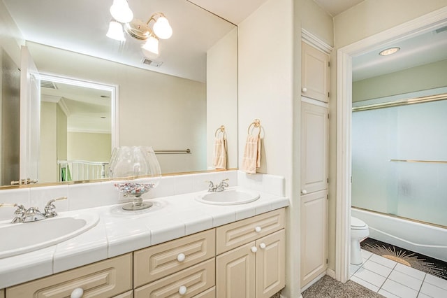 2895 W Kensington Ln, Fresno, CA 93711 - full bathroom with double vanity, toilet, enclosed tub / shower combo, and tile patterned floors
