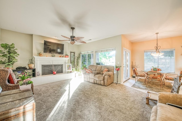 2895 W Kensington Ln, Fresno, CA 93711 - carpeted living area with plenty of natural light, a fireplace, and ceiling fan