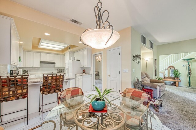2895 W Kensington Ln, Fresno, CA 93711 - dining area featuring a tray ceiling