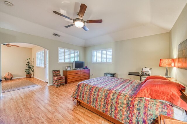 2895 W Kensington Ln, Fresno, CA 93711 - bedroom with wood finished floors, arched walkways, baseboards, a ceiling fan, and vaulted ceiling