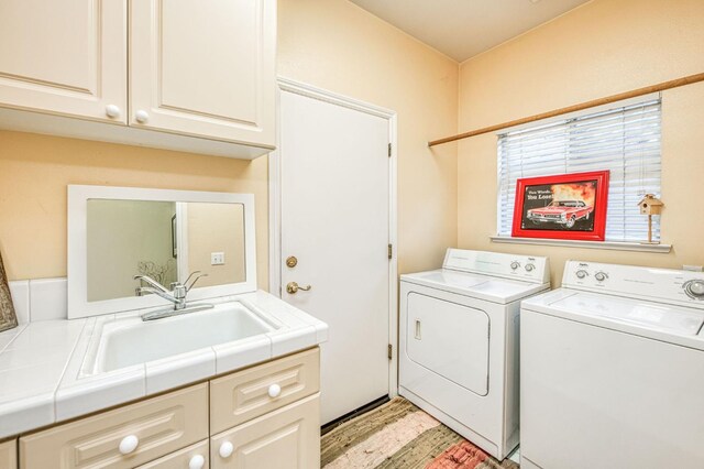 2895 W Kensington Ln, Fresno, CA 93711 - laundry area featuring cabinet space, independent washer and dryer, and light wood finished floors