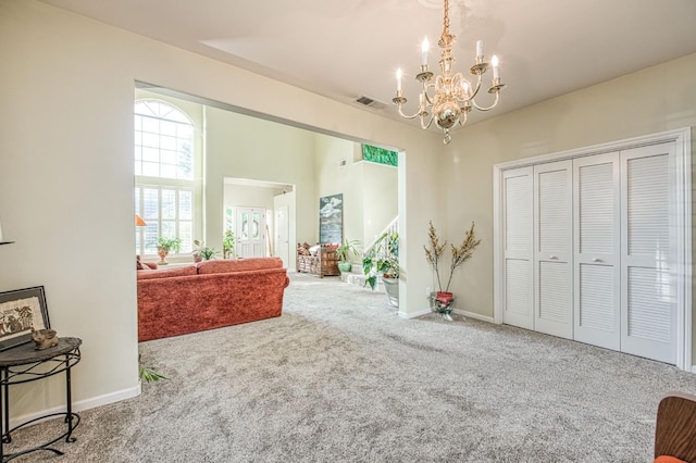 2895 W Kensington Ln, Fresno, CA 93711 - interior space with carpet flooring, a chandelier, and baseboards