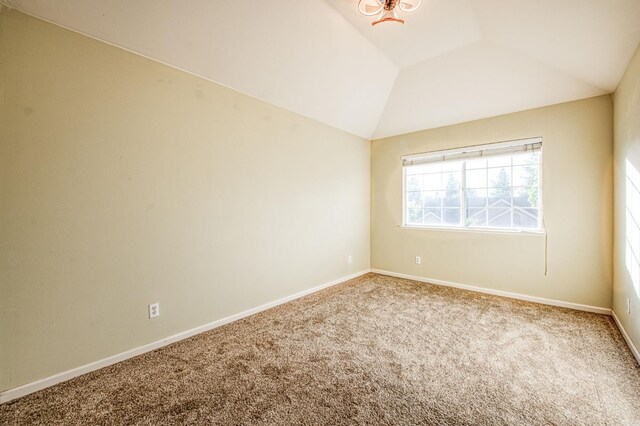 2895 W Kensington Ln, Fresno, CA 93711 - carpeted empty room featuring lofted ceiling and baseboards
