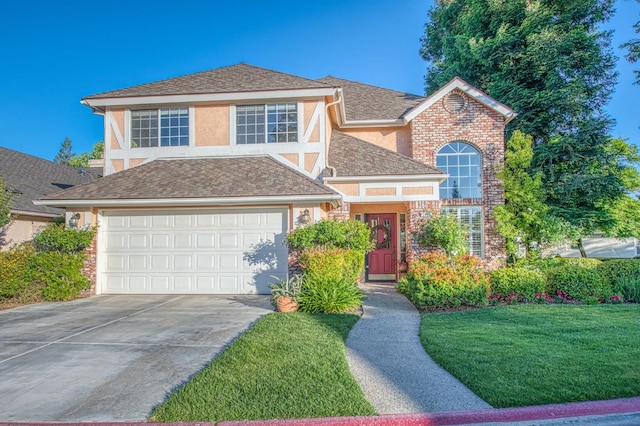 2895 W Kensington Ln, Fresno, CA 93711 - traditional home featuring stucco siding, driveway, a front lawn, and a garage