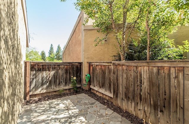 7178 N Fruit Ave Unit 115, Fresno, CA 93711 - fenced backyard featuring a patio