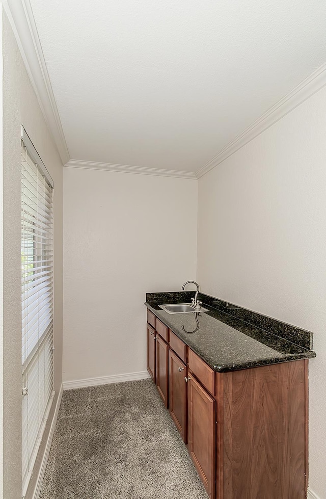 7178 N Fruit Ave Unit 115, Fresno, CA 93711 - bathroom featuring ornamental molding, baseboards, and vanity