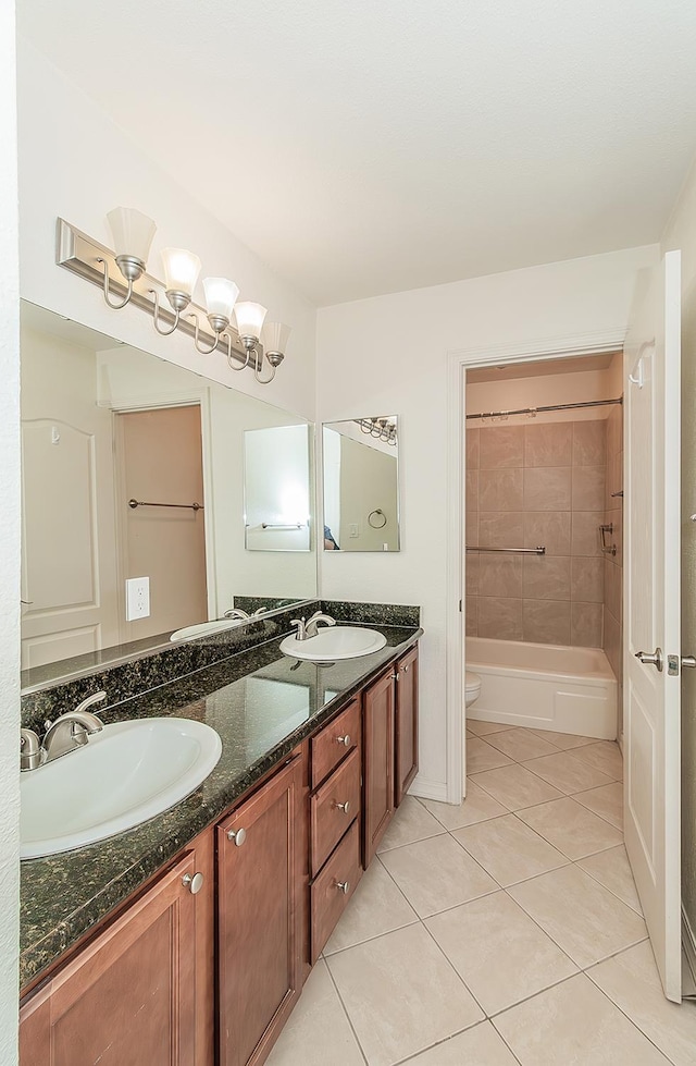 7178 N Fruit Ave Unit 115, Fresno, CA 93711 - bathroom featuring double vanity, tile patterned flooring, toilet, and shower / bathtub combination