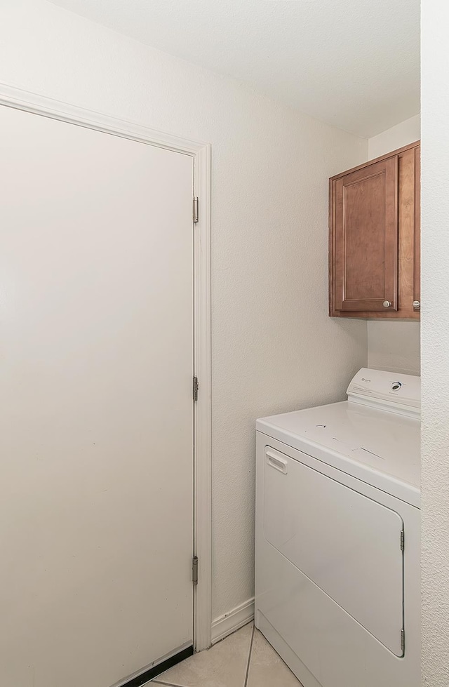 7178 N Fruit Ave Unit 115, Fresno, CA 93711 - laundry room featuring washer / clothes dryer, cabinet space, and light tile patterned flooring