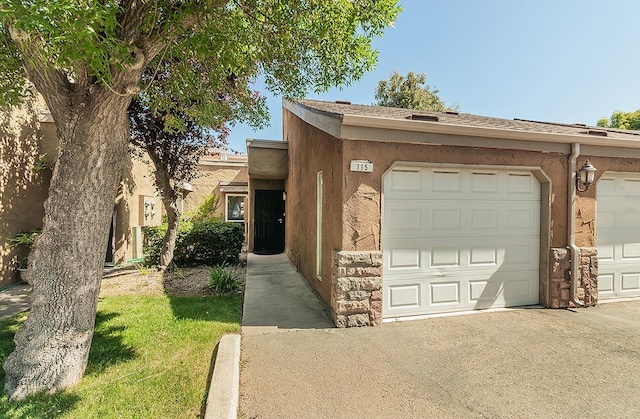 7178 N Fruit Ave Unit 115, Fresno, CA 93711 - view of front of home with stucco siding and community garages