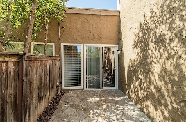 7178 N Fruit Ave Unit 115, Fresno, CA 93711 - doorway to property featuring stucco siding