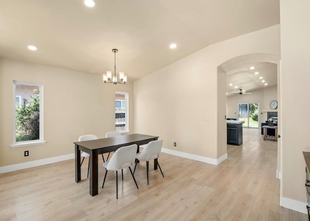 1656 N Cecelia Ave, Fresno, CA 93722 - dining space with recessed lighting, light wood finished floors, arched walkways, a chandelier, and baseboards