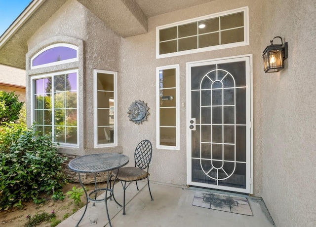 1656 N Cecelia Ave, Fresno, CA 93722 - view of exterior entry featuring stucco siding and a patio