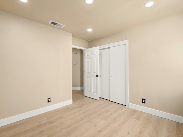 1656 N Cecelia Ave, Fresno, CA 93722 - unfurnished bedroom with baseboards, light wood-style floors, recessed lighting, and a closet