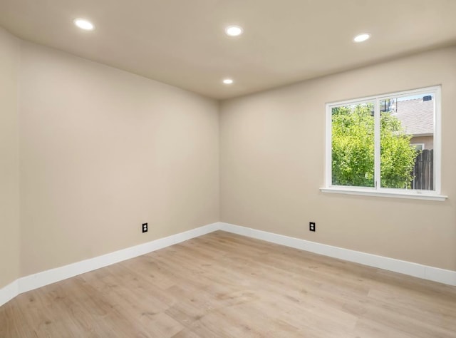 1656 N Cecelia Ave, Fresno, CA 93722 - unfurnished room with recessed lighting, light wood-style floors, and baseboards