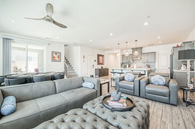 4148 Beverly Ave, Clovis, CA 93619 - living area featuring light wood finished floors, stairway, ceiling fan, and recessed lighting