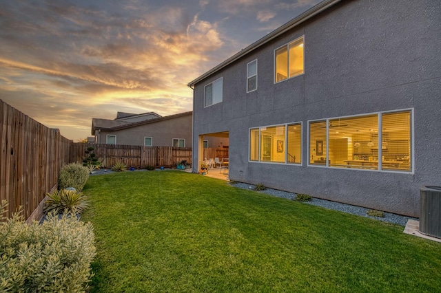 4148 Beverly Ave, Clovis, CA 93619 - back of property at dusk with stucco siding, central AC unit, and a patio