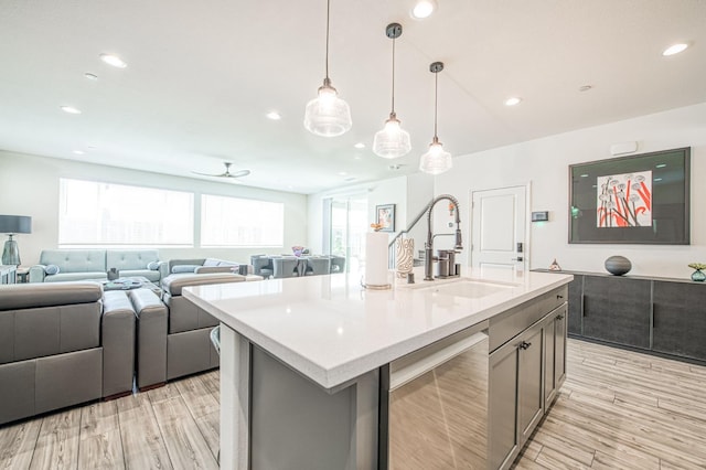 4148 Beverly Ave, Clovis, CA 93619 - kitchen with a sink, light countertops, open floor plan, ceiling fan, and recessed lighting