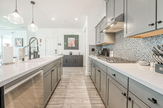 4148 Beverly Ave, Clovis, CA 93619 - kitchen with appliances with stainless steel finishes, gray cabinets, a sink, under cabinet range hood, and recessed lighting