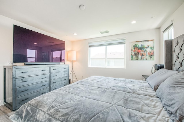 4148 Beverly Ave, Clovis, CA 93619 - bedroom with multiple windows, wood finished floors, recessed lighting, and baseboards