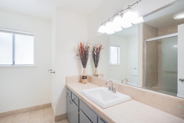 1617 W Indianapolis Ave, Fresno, CA 93705 - full bathroom featuring vanity, a tile shower, baseboards, and tile patterned floors