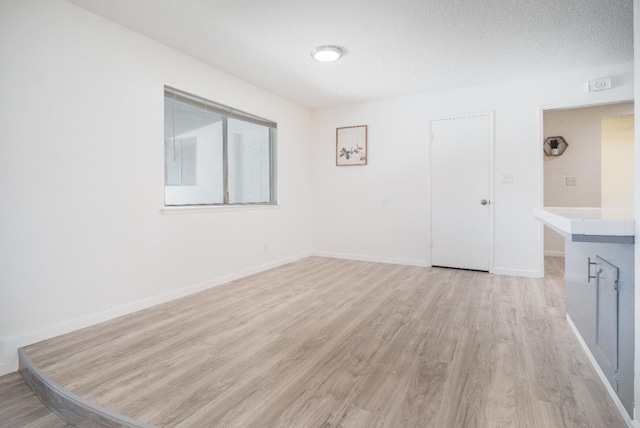 1617 W Indianapolis Ave, Fresno, CA 93705 - empty room featuring light wood-style flooring and baseboards