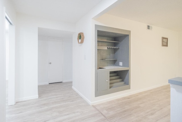 1617 W Indianapolis Ave, Fresno, CA 93705 - corridor with light wood-type flooring and baseboards