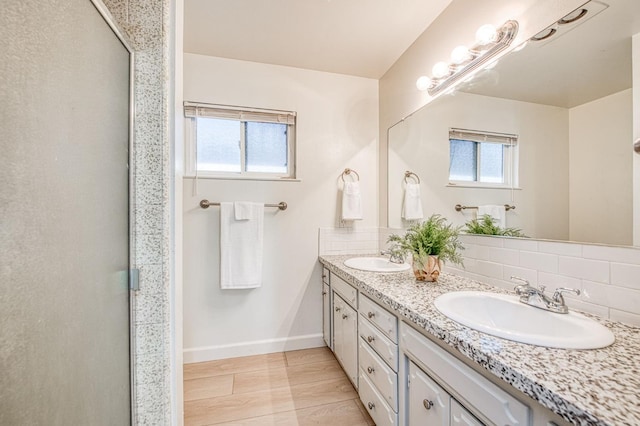 926 E Birch Ave, Fresno, CA 93720 - full bath featuring decorative backsplash, double vanity, baseboards, and a shower with door