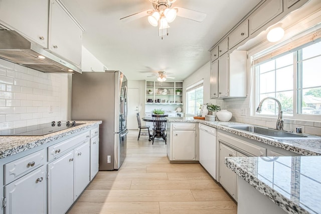 926 E Birch Ave, Fresno, CA 93720 - kitchen featuring black electric stovetop, dishwasher, a ceiling fan, a sink, and under cabinet range hood