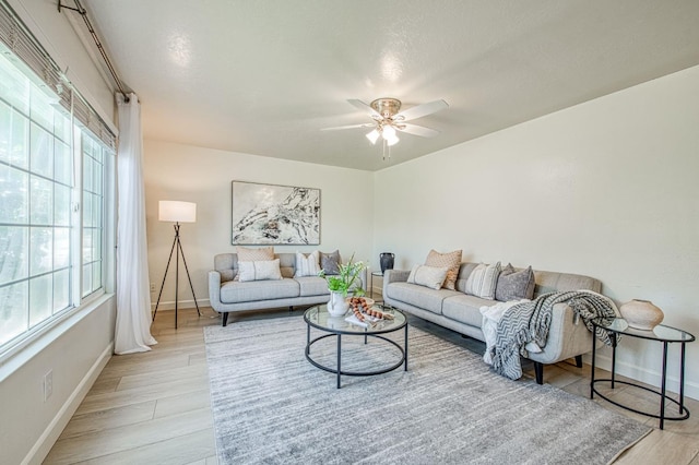926 E Birch Ave, Fresno, CA 93720 - living area with baseboards, light wood-style flooring, and a ceiling fan