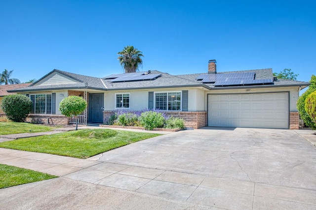 926 E Birch Ave, Fresno, CA 93720 - single story home with driveway, a garage, a front yard, and brick siding