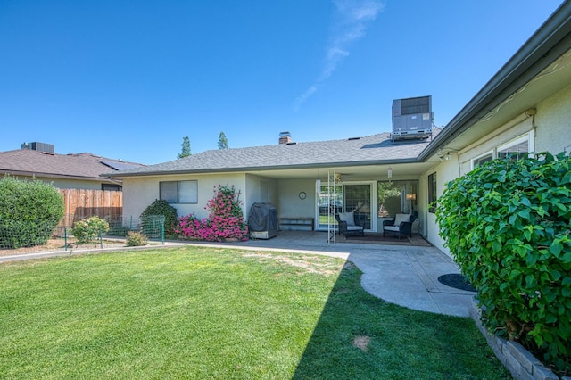 926 E Birch Ave, Fresno, CA 93720 - rear view of property featuring stucco siding, central AC unit, a patio, and a chimney