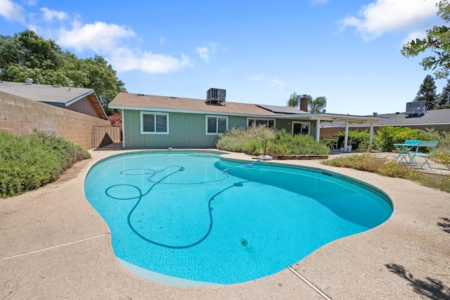 2141 Akers St, Visalia, CA 93277 - view of swimming pool featuring a patio and cooling unit