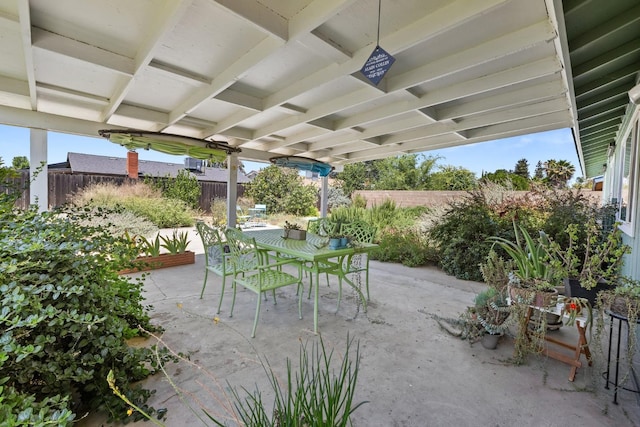 2141 Akers St, Visalia, CA 93277 - fenced backyard with outdoor dining space and a patio