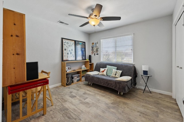 2141 Akers St, Visalia, CA 93277 - living area with wood finished floors, a ceiling fan, and baseboards