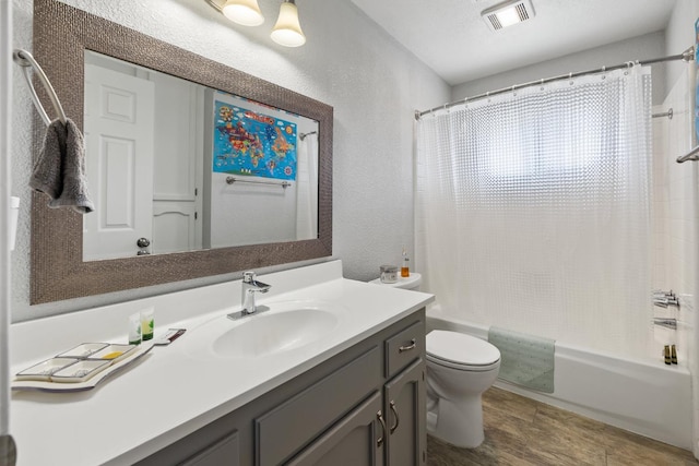 2141 Akers St, Visalia, CA 93277 - full bath with a textured wall, vanity, toilet, and shower / bathtub combination with curtain
