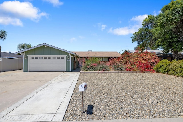 2141 Akers St, Visalia, CA 93277 - ranch-style home featuring a garage, driveway, and board and batten siding