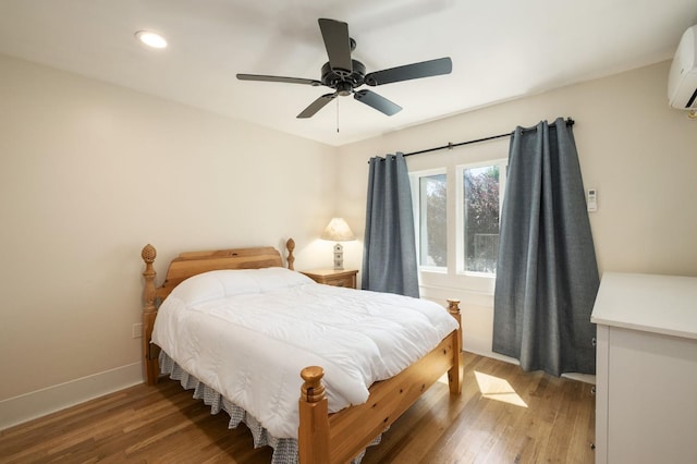 334 E Gettysburg Ave, Fresno, CA 93704 - bedroom featuring light wood-type flooring, recessed lighting, baseboards, ceiling fan, and a wall mounted air conditioner
