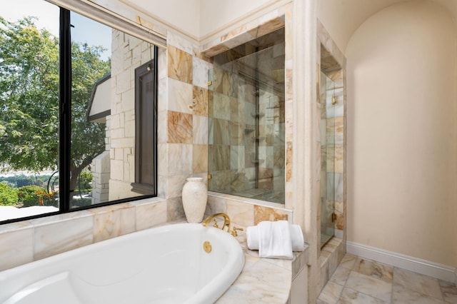 14215 Killarney Dr, Madera, CA 93636 - bathroom with a bath, a stall shower, baseboards, and marble finish floors