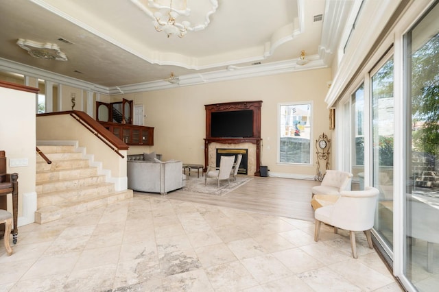 14215 Killarney Dr, Madera, CA 93636 - living room with stairs, crown molding, a chandelier, and a high end fireplace