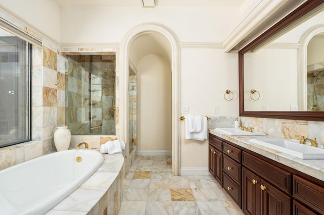 14215 Killarney Dr, Madera, CA 93636 - full bath with double vanity, a garden tub, a shower stall, marble finish flooring, and baseboards