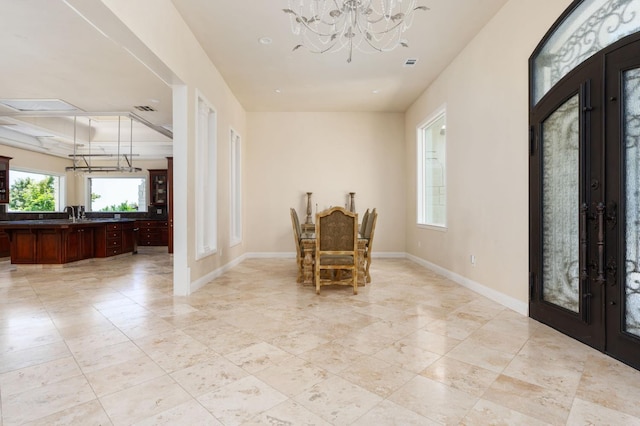 14215 Killarney Dr, Madera, CA 93636 - foyer entrance with french doors, a chandelier, baseboards, and light tile patterned flooring