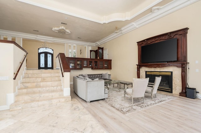 14215 Killarney Dr, Madera, CA 93636 - living area featuring stairs, crown molding, a premium fireplace, light wood finished floors, and french doors